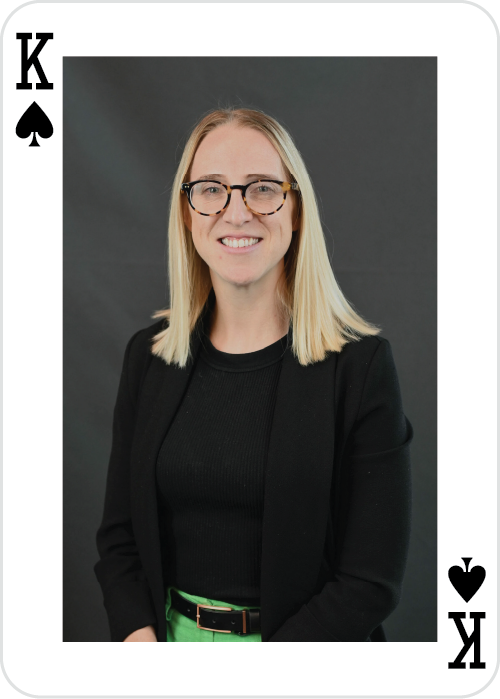 a woman wearing glasses and a black jacket