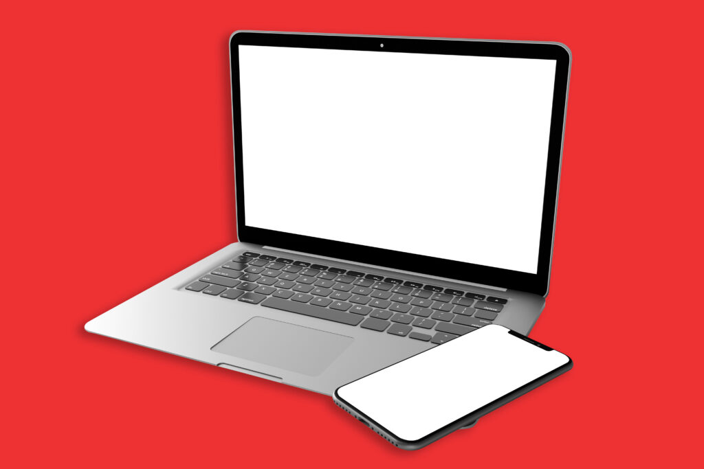 Laptop and mobile on red background